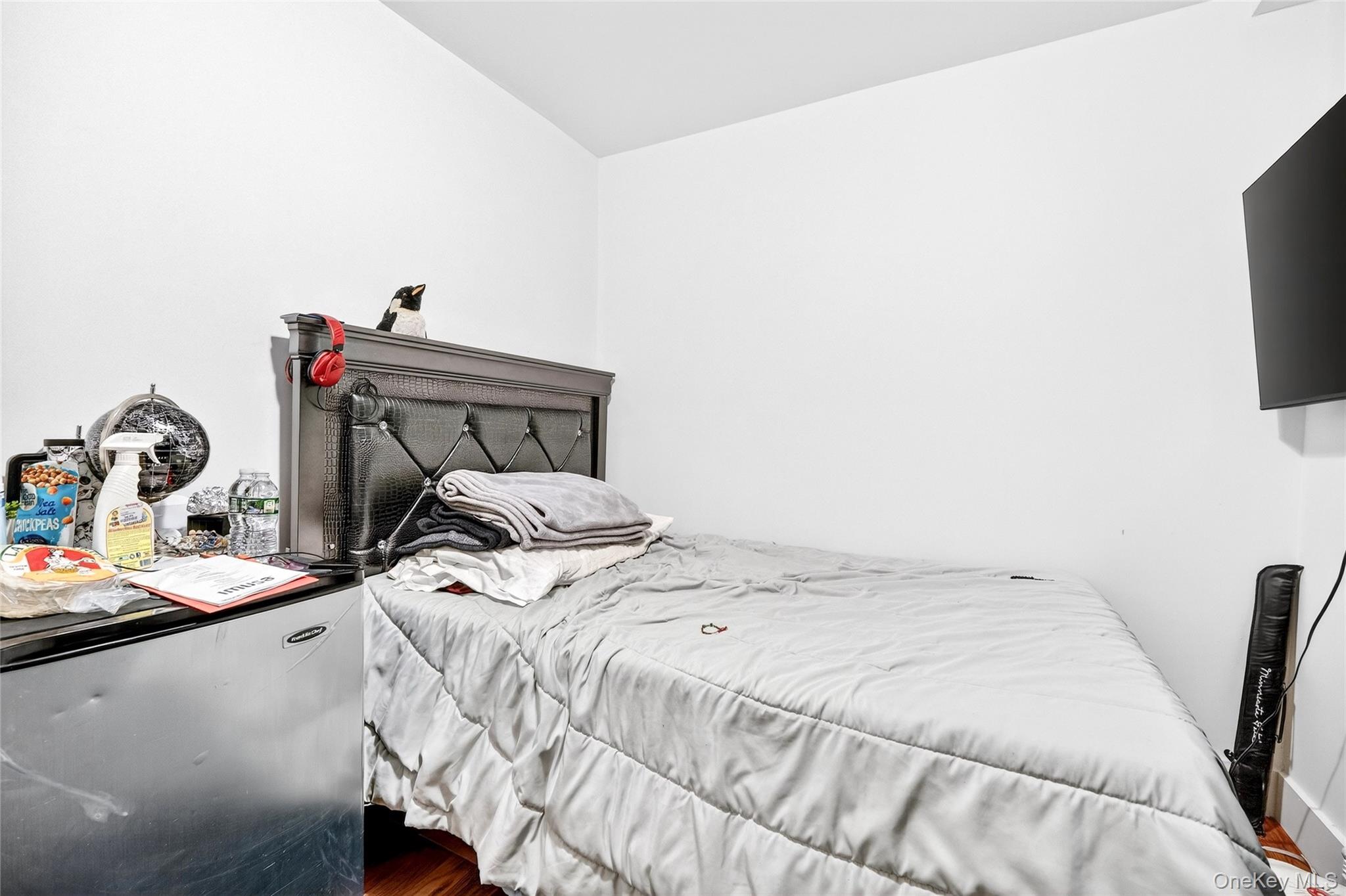 1459 Rosedale Avenue Bronx, NY 10460 - Photo 29 of 37 a bedroom with a bed and a flat screen tv