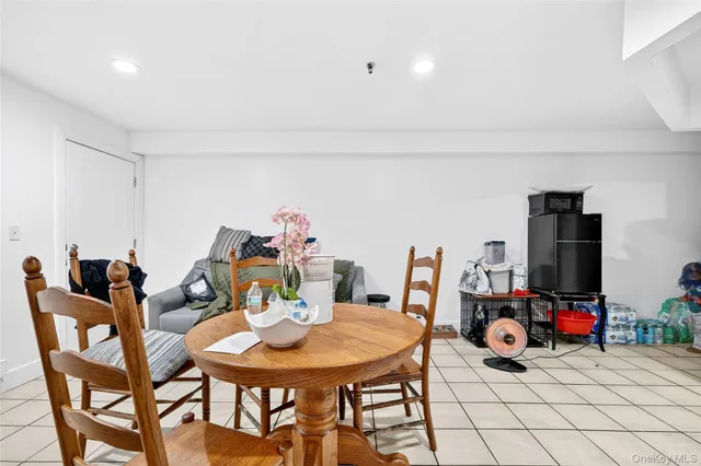 a view of a dining room with furniture and a table