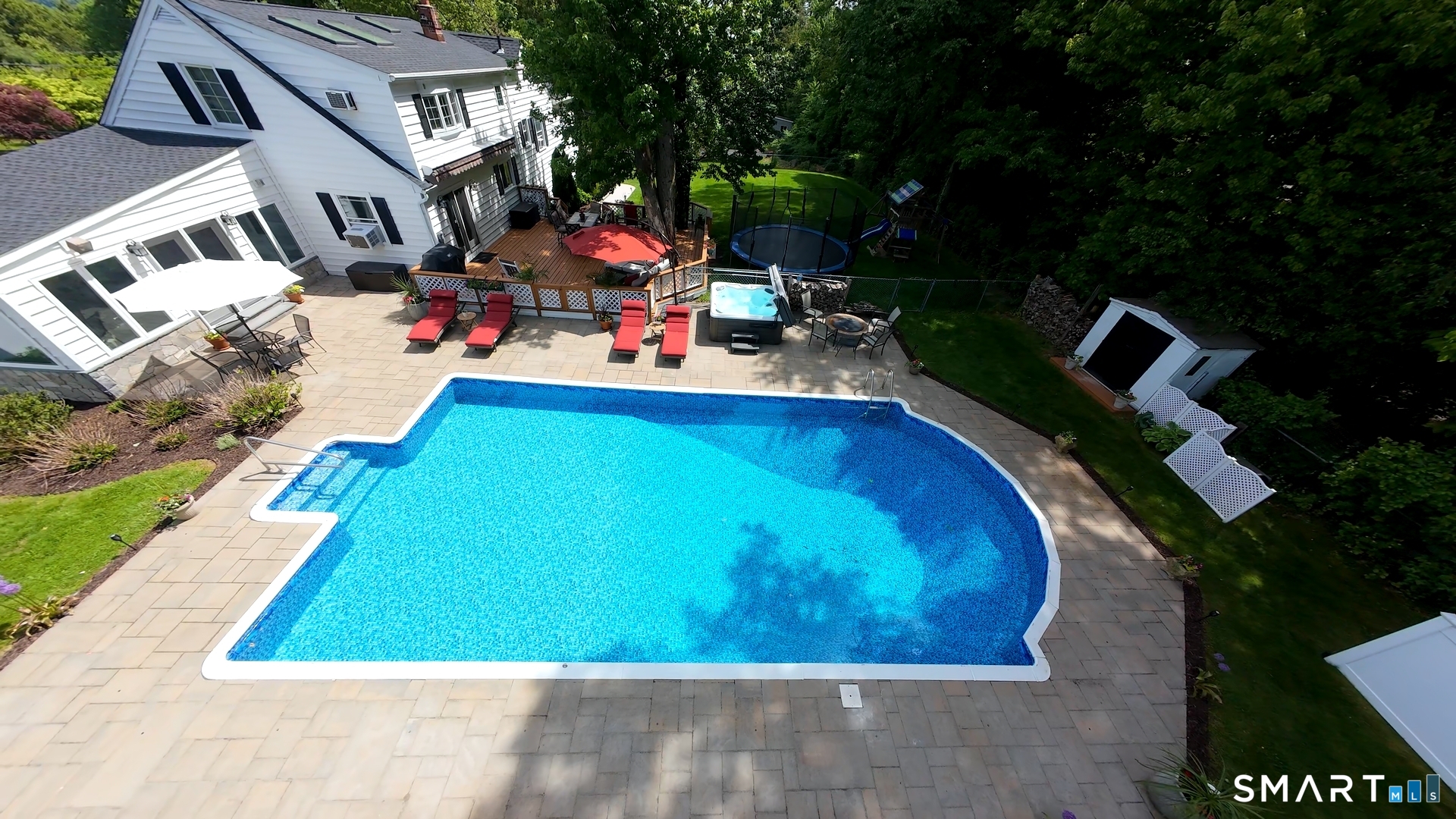 13 Pleasant Rise Circle Brookfield, CT 06804 - Photo 13 of 40 a view of a backyard with a patio and fire pit