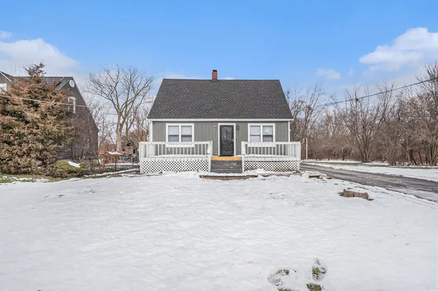 a house that has a tree in front of it