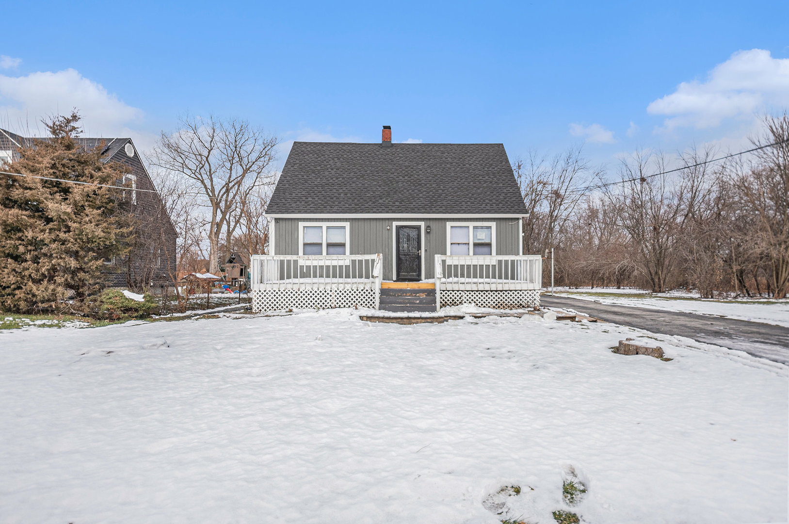 a house that has a tree in front of it