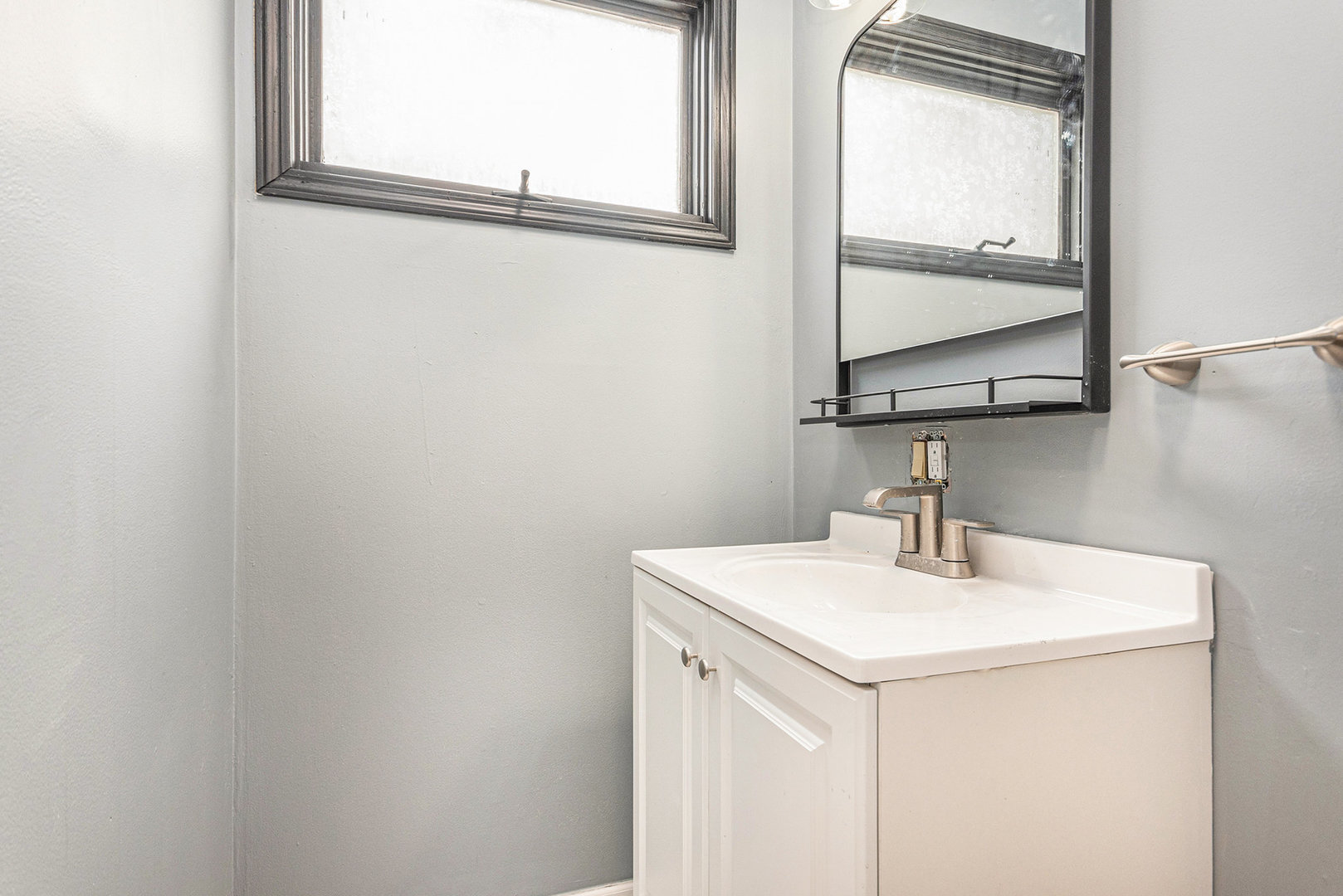 353 202nd Street Chicago Heights, IL 60411 - Photo 13 of 33 a bathroom with a sink and a mirror