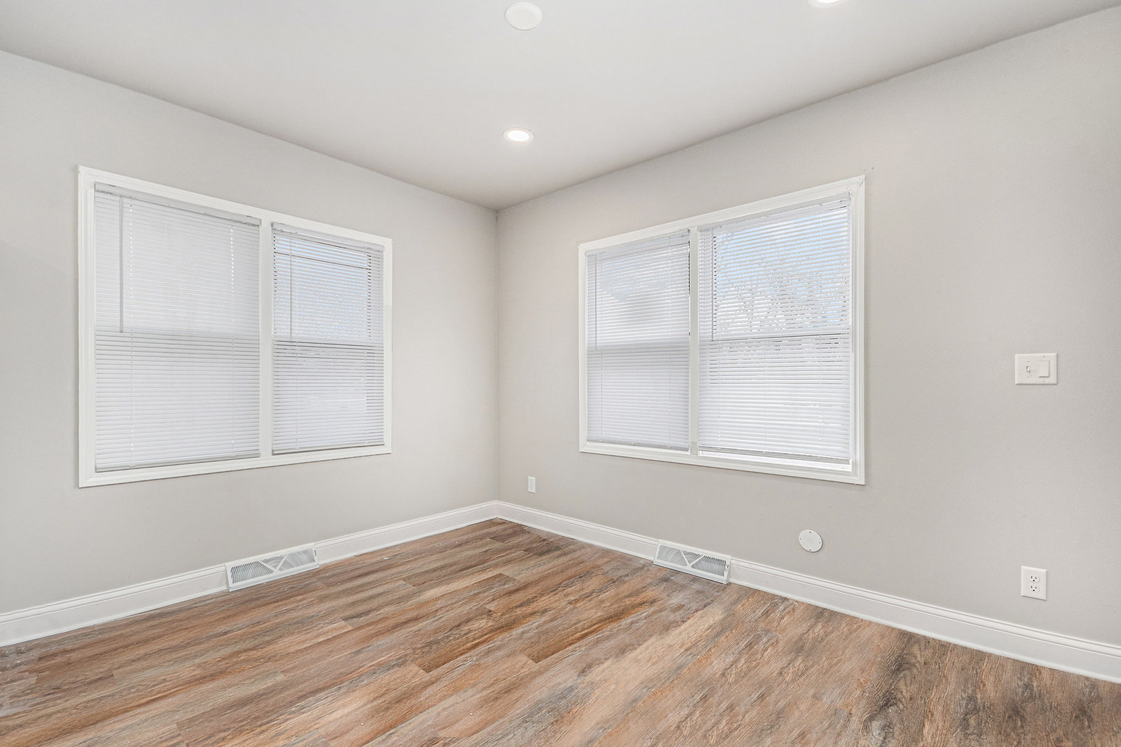 353 202nd Street Chicago Heights, IL 60411 - Photo 18 of 33 an empty room with wooden floor and windows