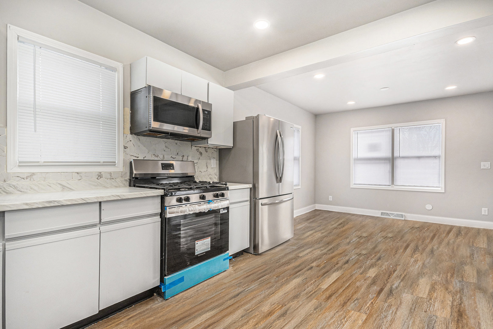 353 202nd Street Chicago Heights, IL 60411 - Photo 4 of 33 a kitchen with stainless steel appliances granite countertop a stove a sink and a microwave