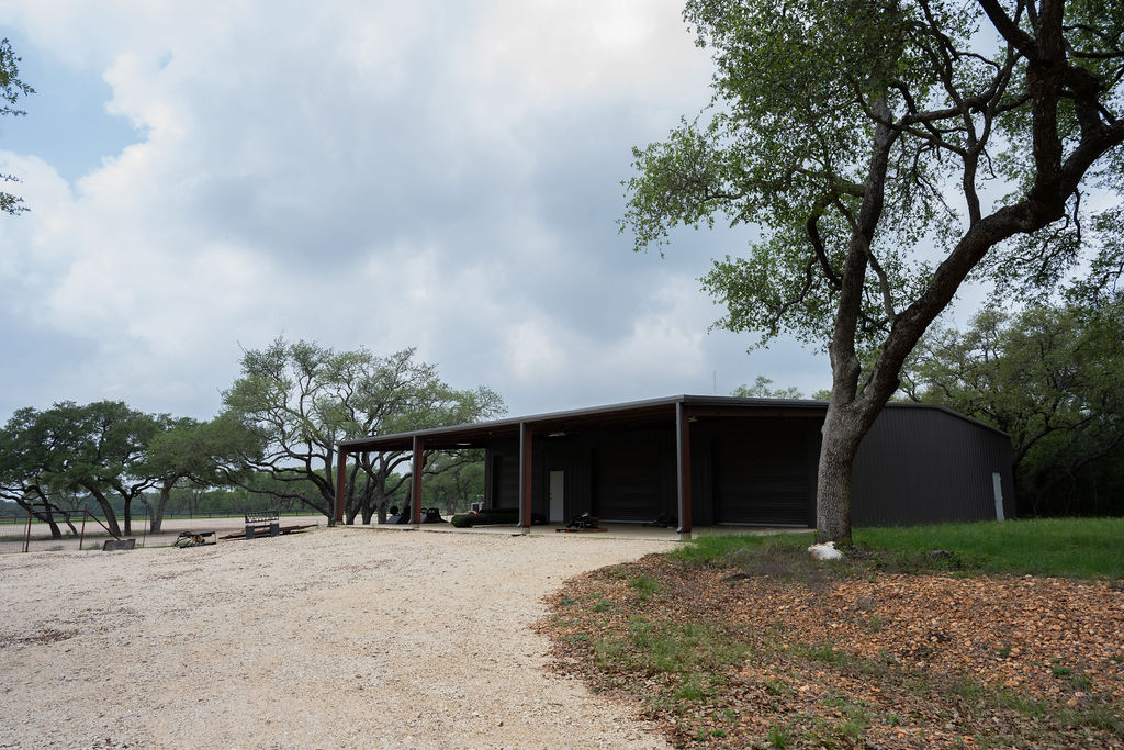 426 Mill Run New Braunfels, TX 78132 - Photo 14 of 40 a front view of a house with a yard and garage