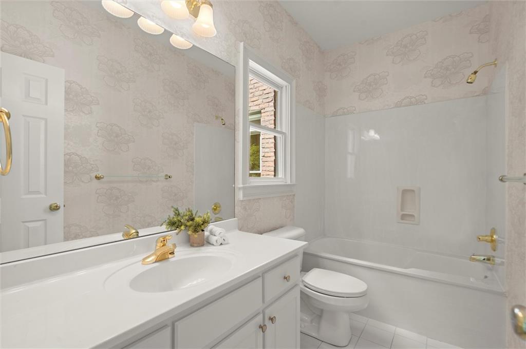 1200 Bay Pointe Terrace Alpharetta, GA 30005 - Photo 20 of 56 a bathroom with a sink a toilet and shower