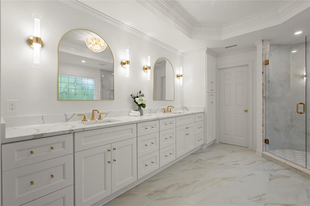 1200 Bay Pointe Terrace Alpharetta, GA 30005 - Photo 22 of 56 a spacious bathroom with double vanity a mirror a double vanity sinks and a shower
