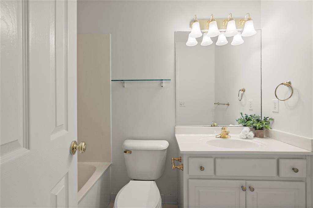 1200 Bay Pointe Terrace Alpharetta, GA 30005 - Photo 29 of 56 a bathroom with a sink a mirror and a toilet