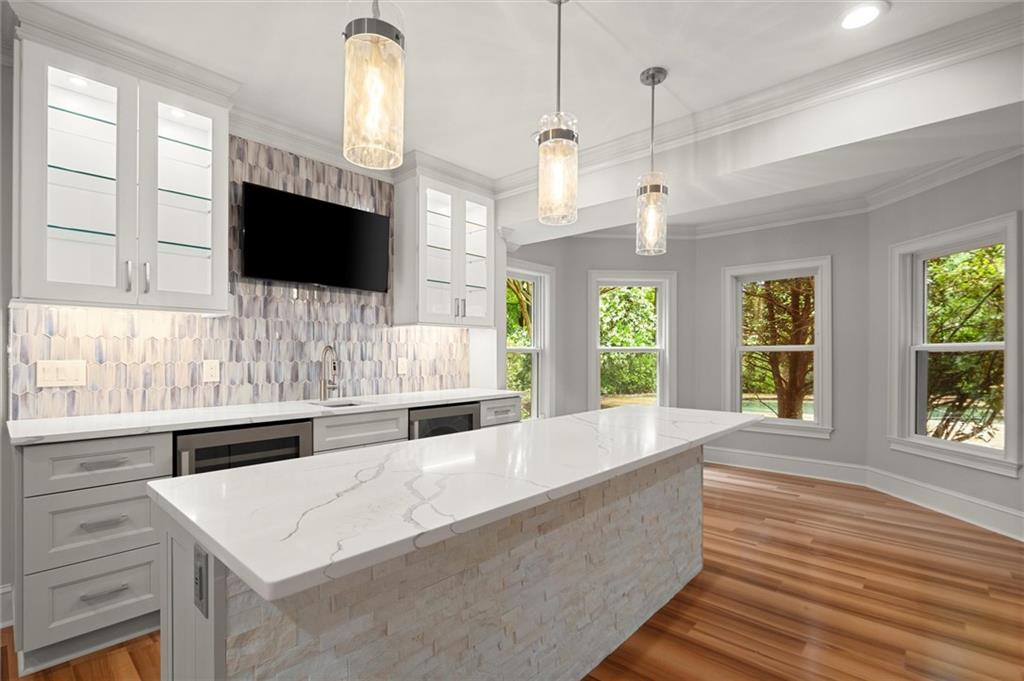 1200 Bay Pointe Terrace Alpharetta, GA 30005 - Photo 35 of 56 a large white kitchen with a large window and a fireplace