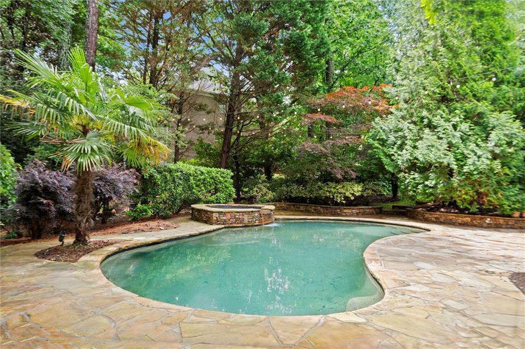 1200 Bay Pointe Terrace Alpharetta, GA 30005 - Photo 47 of 56 a view of a swimming pool with a yard