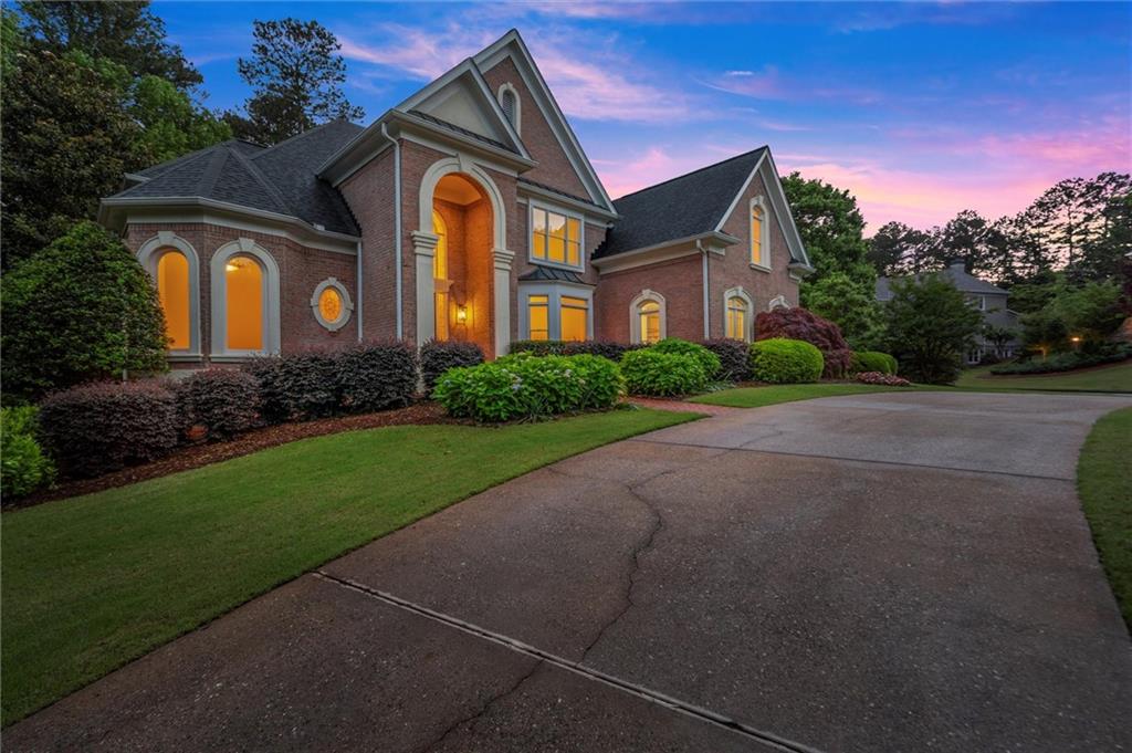 1200 Bay Pointe Terrace Alpharetta, GA 30005 - Photo 53 of 56 a front view of a house with a yard
