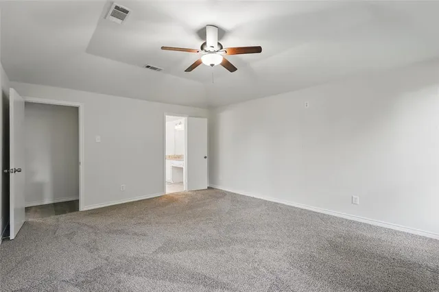 a view of room with ceiling fan