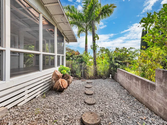 a wooden bench sitting in front of a building