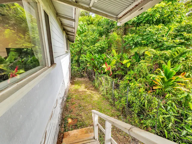 a view of balcony with wooden floor