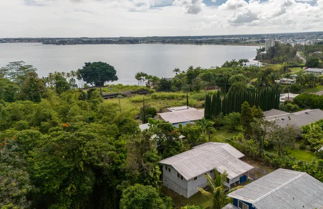 a view of a lake with sitting area and lake view