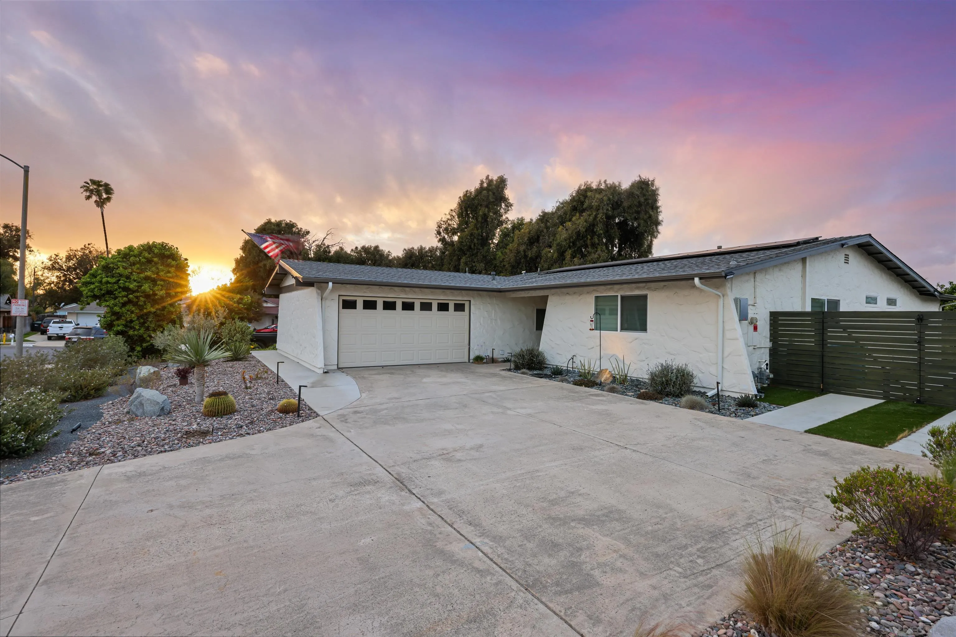 4016 Via Rio Avenue Oceanside, CA 92057 - Photo 1 of 34 front view of a house with a yard and a large tree