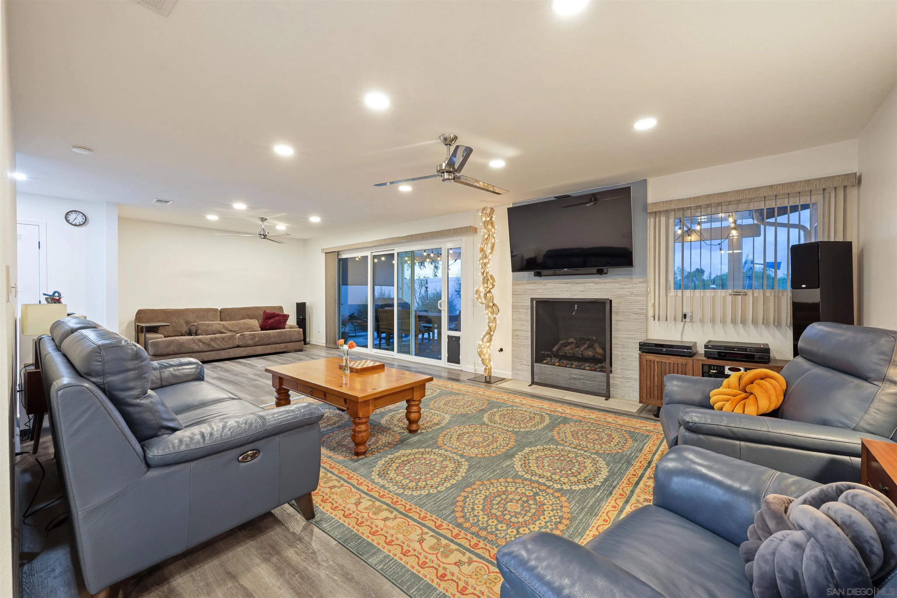 4016 Via Rio Avenue Oceanside, CA 92057 - Photo 12 of 34 a living room with furniture and a fireplace