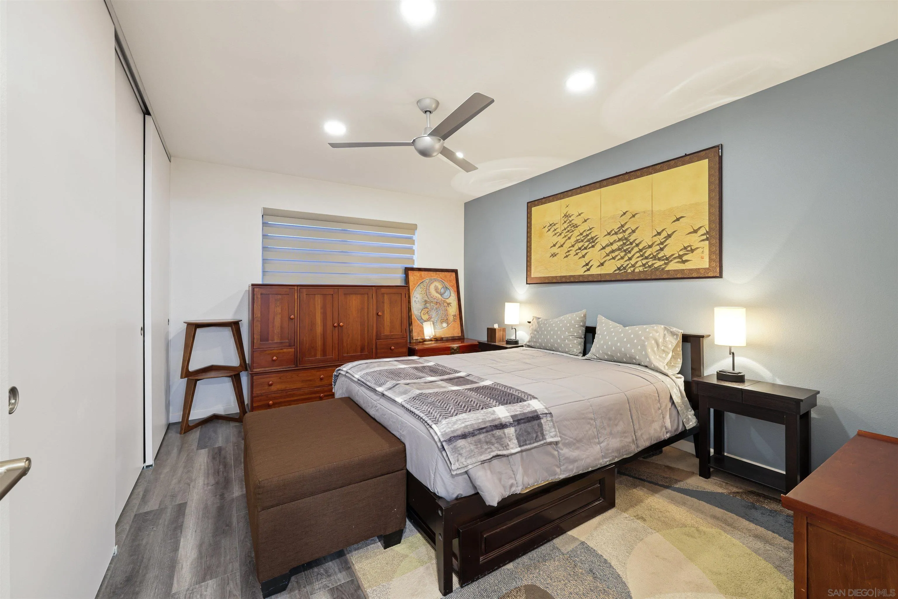 4016 Via Rio Avenue Oceanside, CA 92057 - Photo 14 of 34 a bedroom with a bed and a wall painting