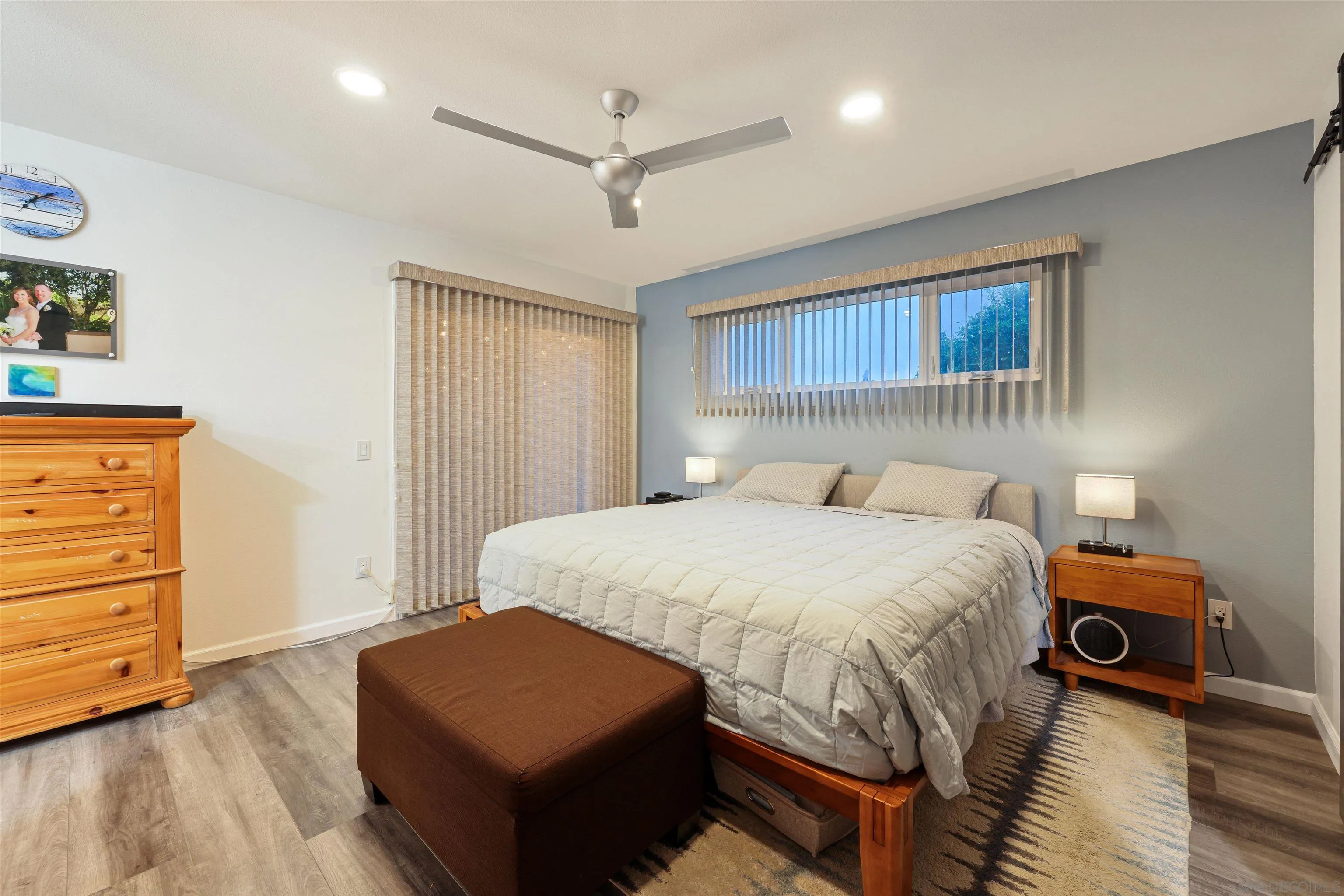 4016 Via Rio Avenue Oceanside, CA 92057 - Photo 17 of 34 a bedroom with a bed and wooden floor