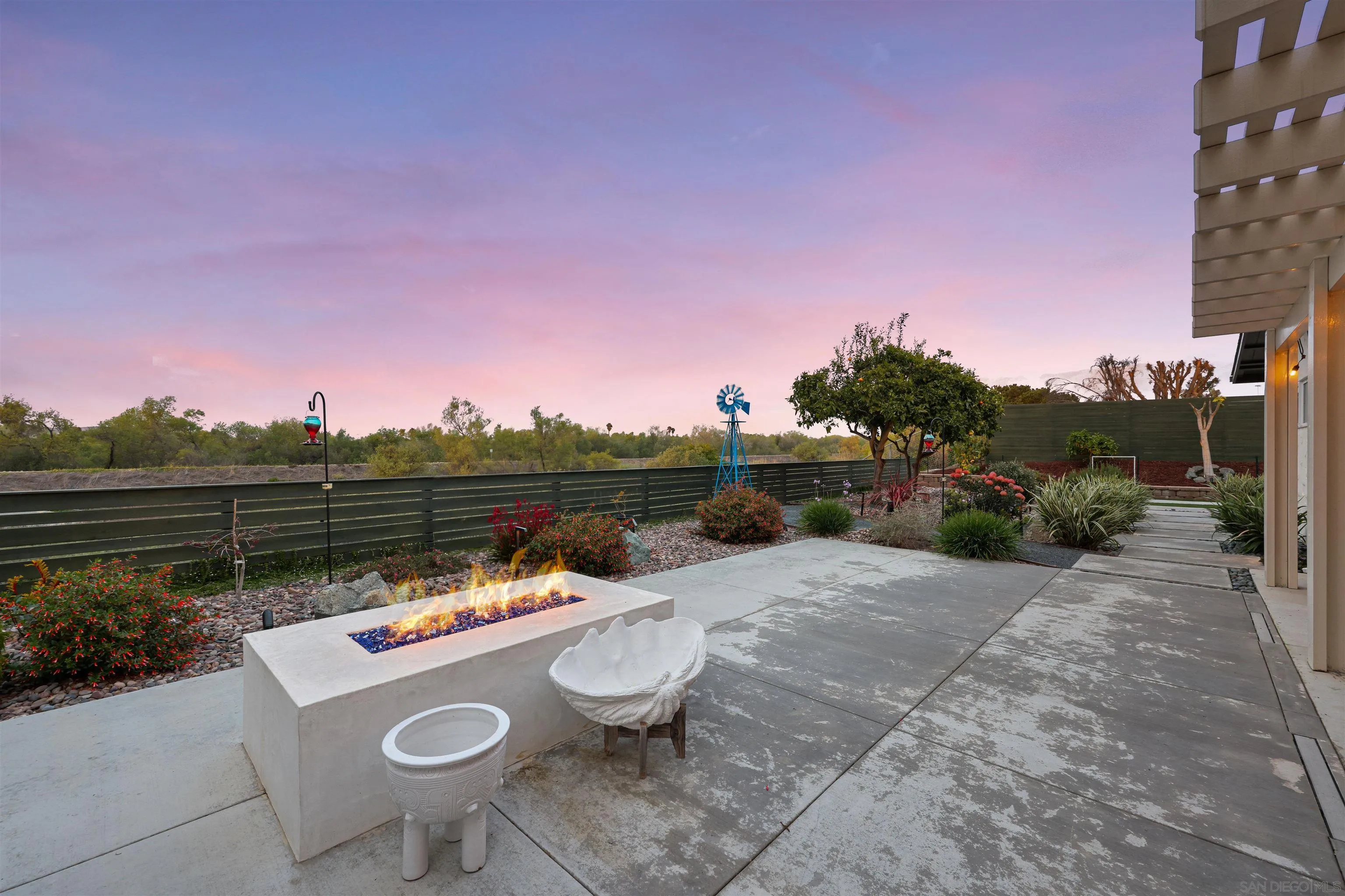 4016 Via Rio Avenue Oceanside, CA 92057 - Photo 22 of 34 a view of a chairs and table in backyard