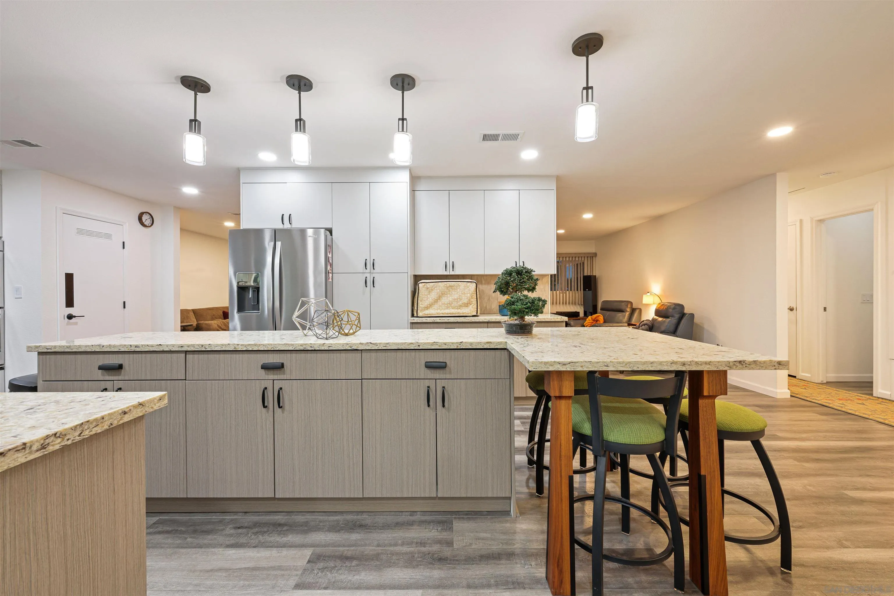 4016 Via Rio Avenue Oceanside, CA 92057 - Photo 6 of 34 a spacious kitchen with a table chairs sink and cabinets