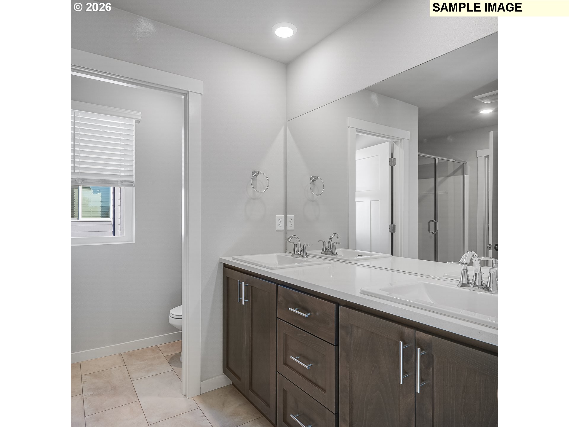 1092 Legacy Street Eugene, OR 97402 - Photo 12 of 20 a bathroom with a granite countertop sink a toilet and a mirror
