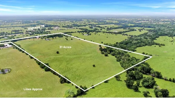 an aerial view of a house with a garden