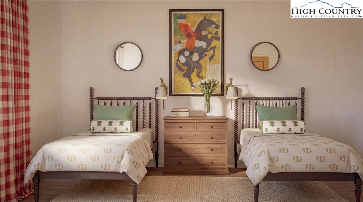 The Raynor Condos, Unit 2D Blowing Rock, NC 28605 - Photo 13 of 22 a bedroom with a bed and cabinets