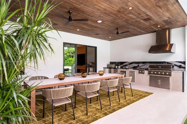a living room with furniture and flat screen tv