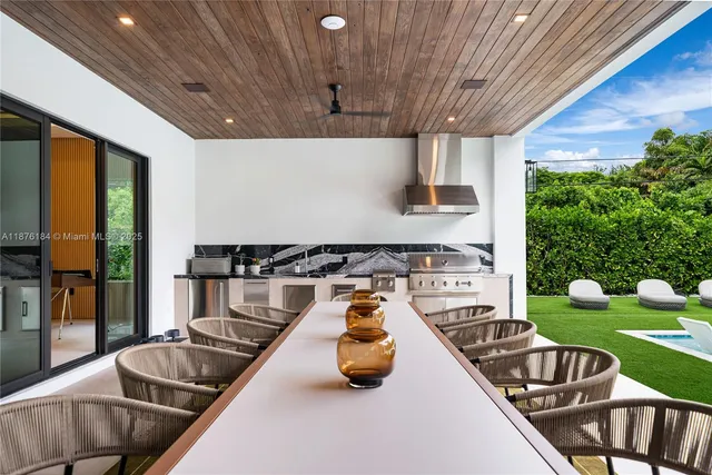 a dining room with furniture and a chandelier