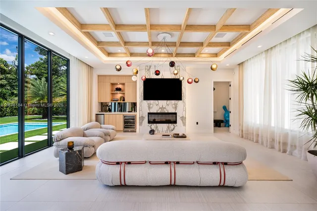 a kitchen with kitchen island a counter top space a sink stainless steel appliances and cabinets