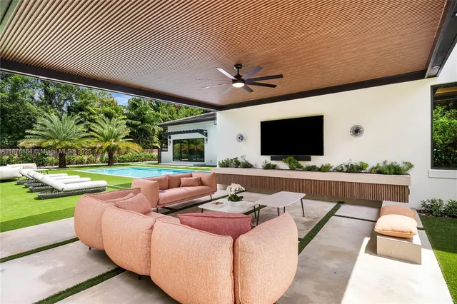 a bedroom with bed and flat screen tv