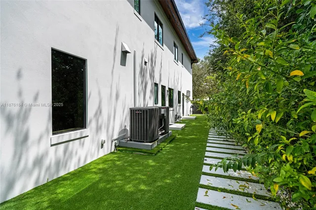 a bedroom with furniture and a book shelf