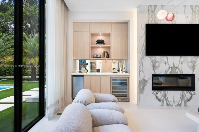 a view of a patio with table and chairs with wooden floor and plants