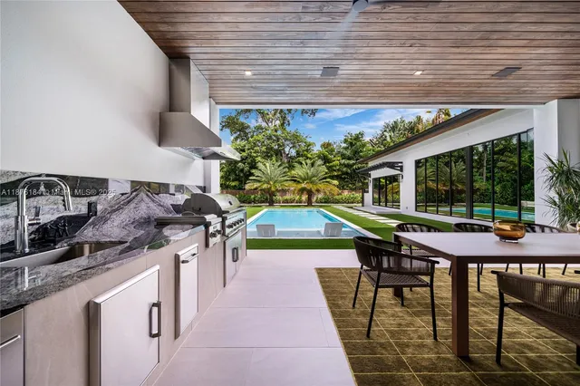 a living room with furniture fireplace and flat screen tv