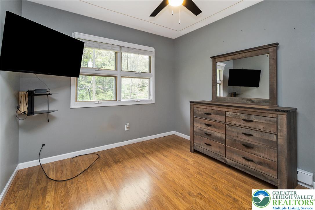 135 Haney Road Kunkletown, PA 18058 - Photo 26 of 53 a bedroom with a bed and a flat screen tv