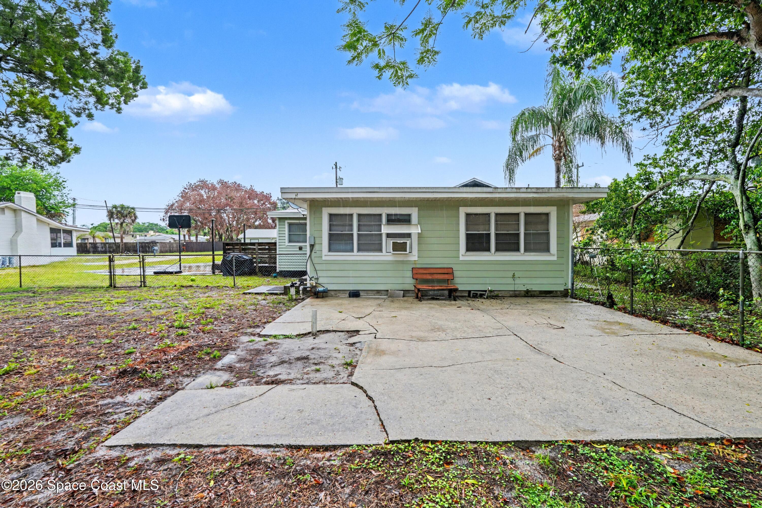 1708 Pine Street, Unit 2 Melbourne, FL 32901 - Photo 15 of 21 a view of a house with a yard