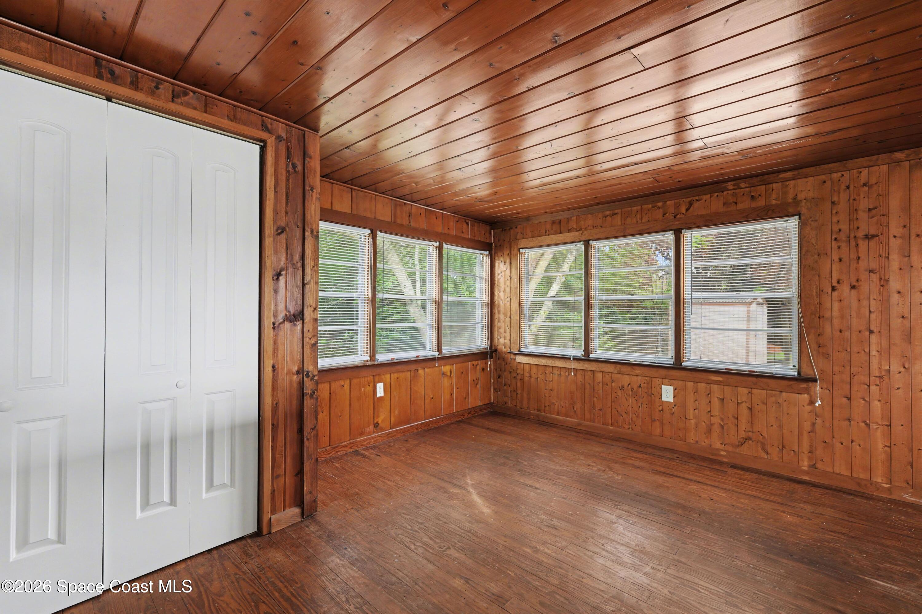 1708 Pine Street, Unit 2 Melbourne, FL 32901 - Photo 4 of 21 a view of an empty room with wooden floor and a window