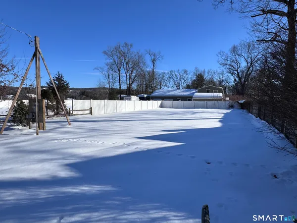 a view of a walk in the middle of a yard