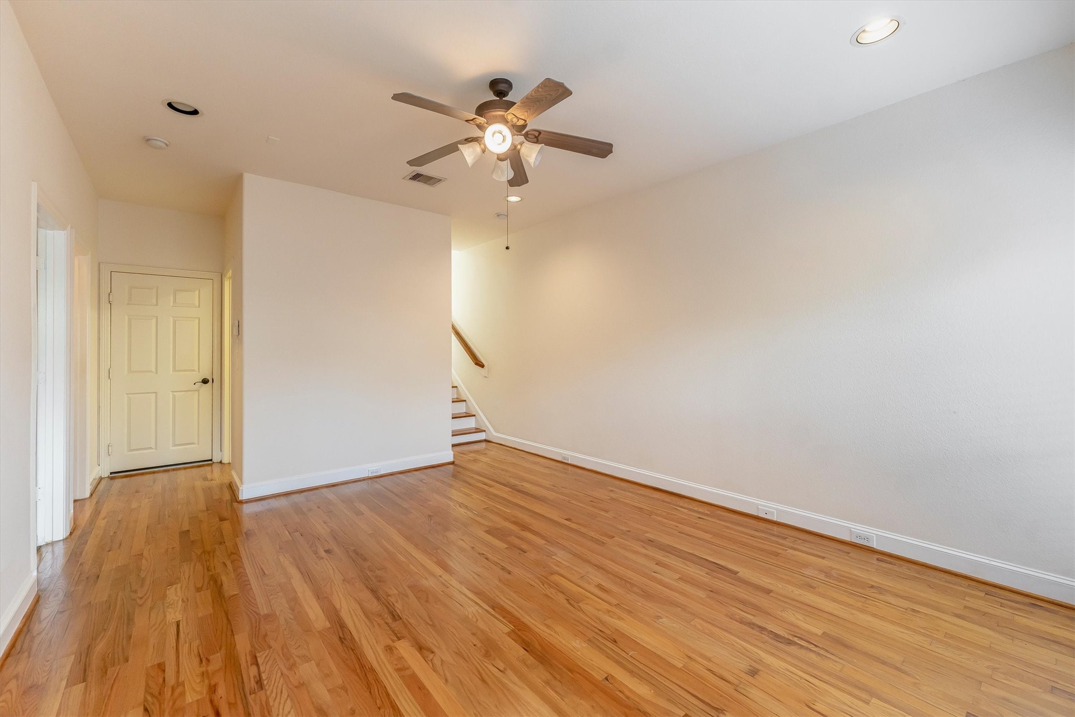 308 Grove Street Houston, TX 77020 - Photo 23 of 28 a view of an empty room with wooden floor