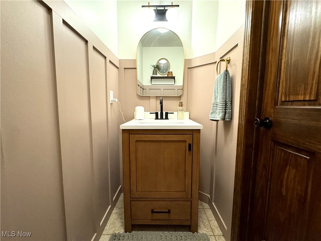 3450 Secrest Road Wooster, OH 44691 - Photo 17 of 34 Bathroom featuring baseboards and vanity
