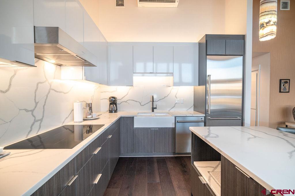 35111 Rd K.1 Mancos, CO 81328 - Photo 12 of 35 a kitchen with a sink stove and refrigerator
