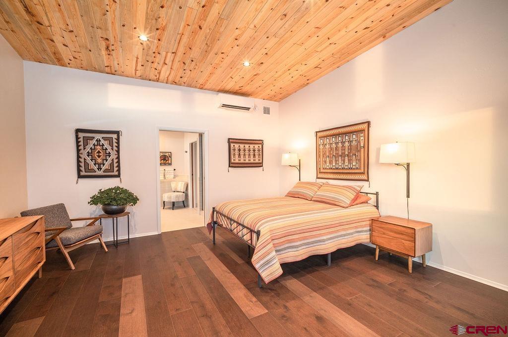 35111 Rd K.1 Mancos, CO 81328 - Photo 16 of 35 a spacious bedroom with a bed and a table