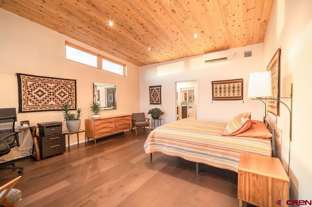 35111 Rd K.1 Mancos, CO 81328 - Photo 17 of 35 a bedroom with a bed and wooden floor