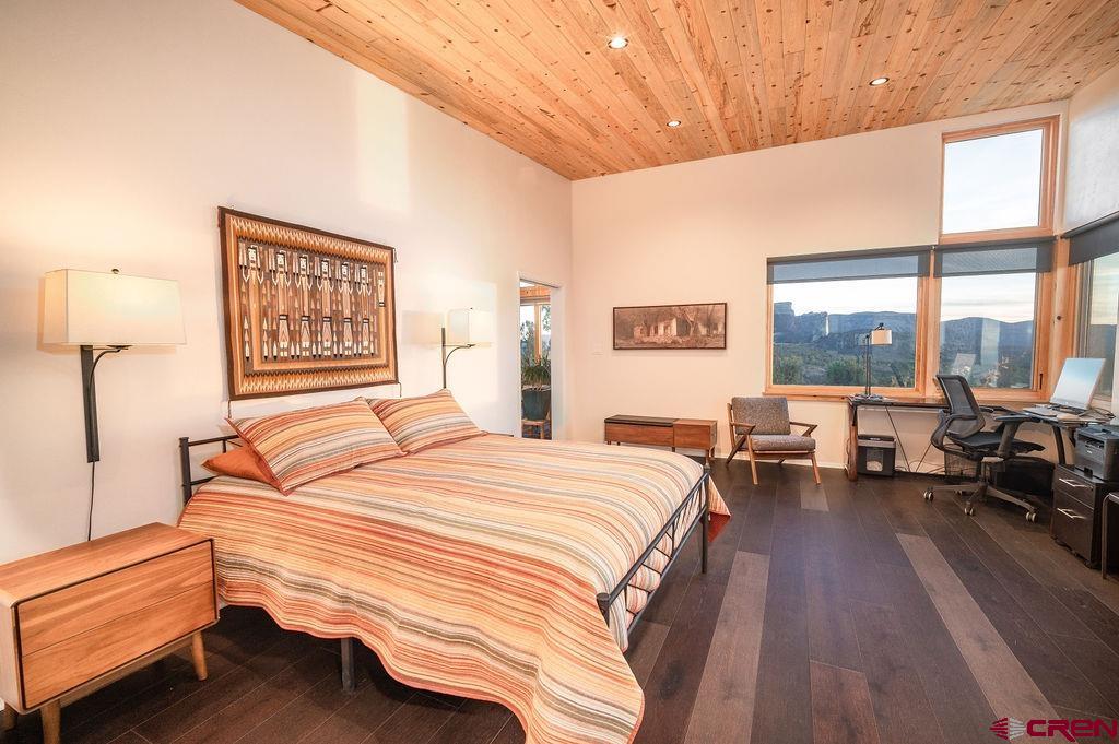 35111 Rd K.1 Mancos, CO 81328 - Photo 18 of 35 a bedroom with a bed and a large window