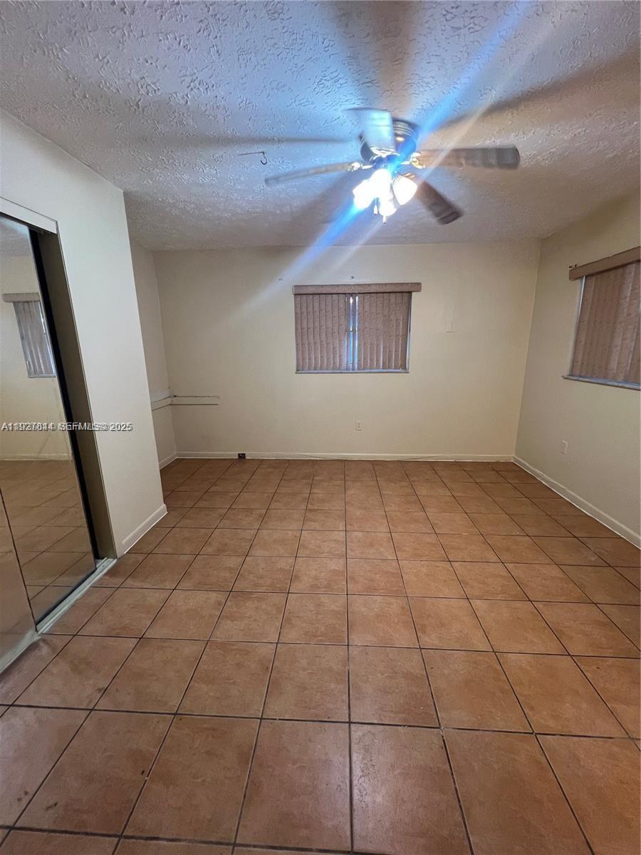 1581 Northeast 117th Street Miami, FL 33161 - Photo 14 of 29 a view of an empty room with a window