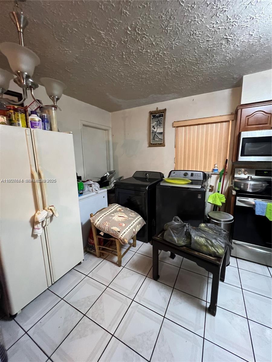 1581 Northeast 117th Street Miami, FL 33161 - Photo 24 of 29 a livingroom with workspace and a window