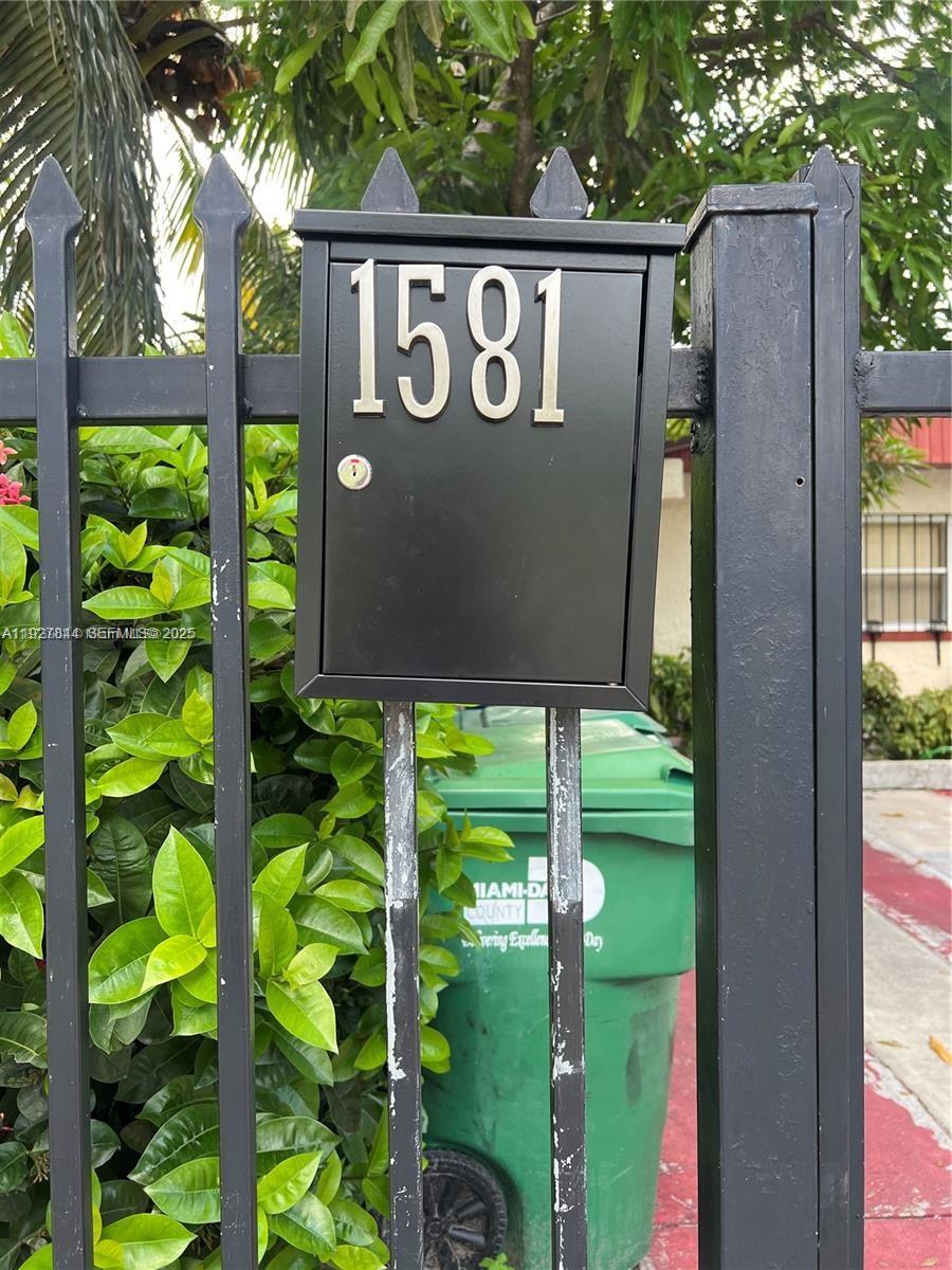 1581 Northeast 117th Street Miami, FL 33161 - Photo 28 of 29 a sign that is sitting in front of a building