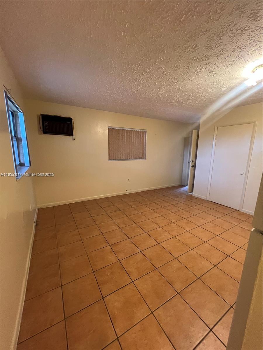 1581 Northeast 117th Street Miami, FL 33161 - Photo 9 of 29 a view of an empty room and window
