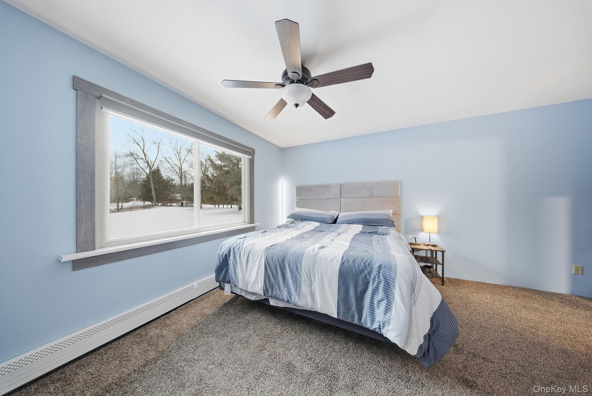 41 Low Road Wallkill, NY 12589 - Photo 22 of 37 Bedroom with a baseboard heating unit, carpet, and a ceiling fan